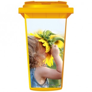 Young Girl Sniffing A Sunflower Wheelie Bin Sticker Panel